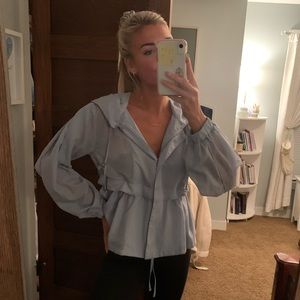 Sheer zip up peplum sweater. Light blue